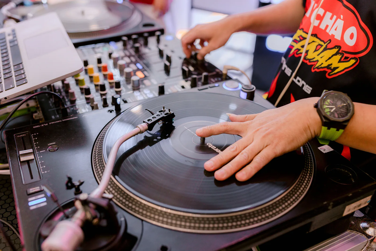 DJ hands working the turntables