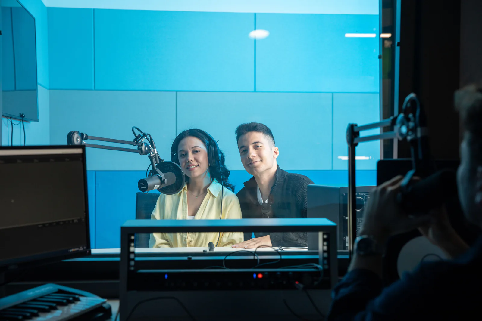 Two hosts on the air in the KBCN radio studio